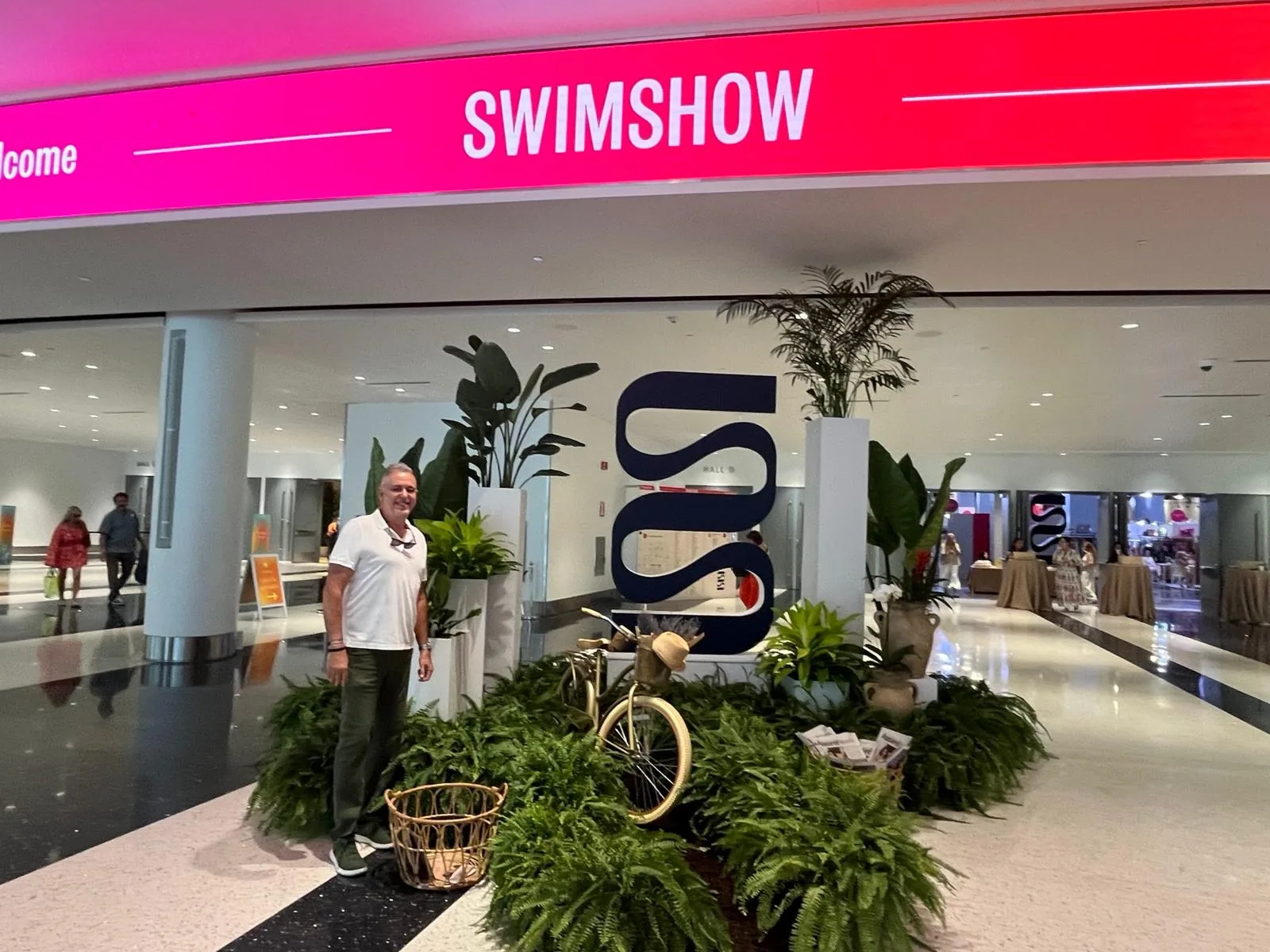 Palms and ferns styling the SWIMSHOW entrance at the Miami Beach Convention Center